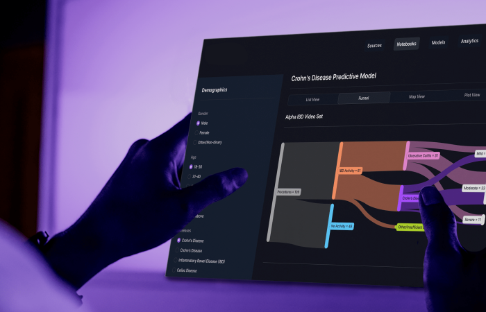 Healthcare professional using AI to organize GI research data.